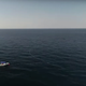 A frame from a YouTube documentary on the Ocean Builder's seasteader project. In the photo you see the 6 meter wide floating cabin with a moored powerboat nearby.